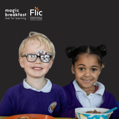 Two primary school children smile at the camera as they enjoy a magic breakfast. Magic Breakfast and FLIC's logos sit above them.