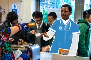 Poster of a school aged students eating breakfast with having doctors clothing and stethoscope superimposed on top of him to link the importance of breakfast and education outcomes.